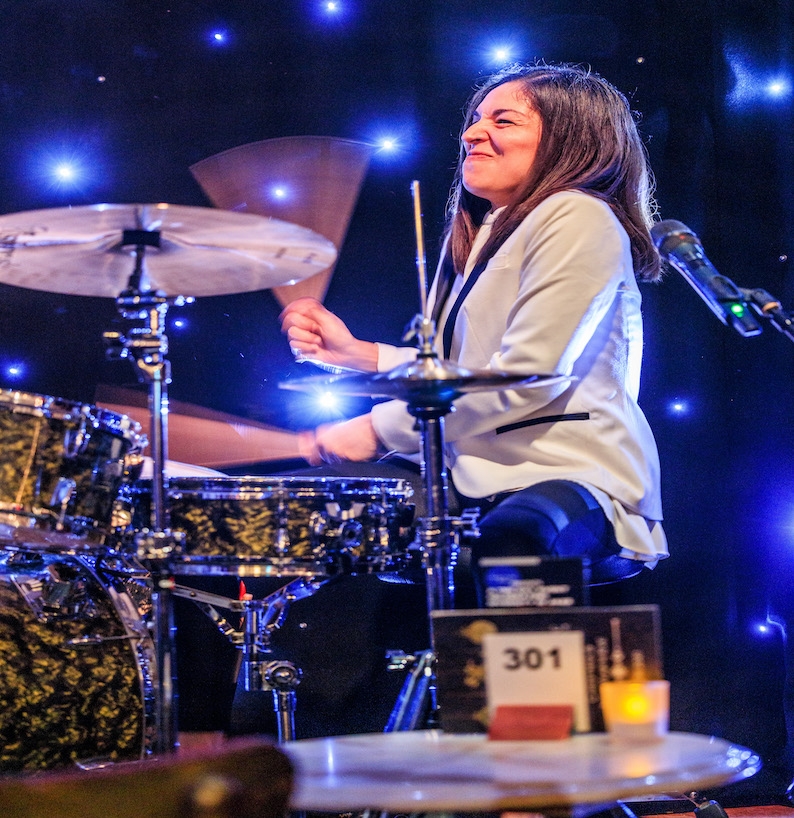 Migdalia Van der Hoven action shot at the drum kit