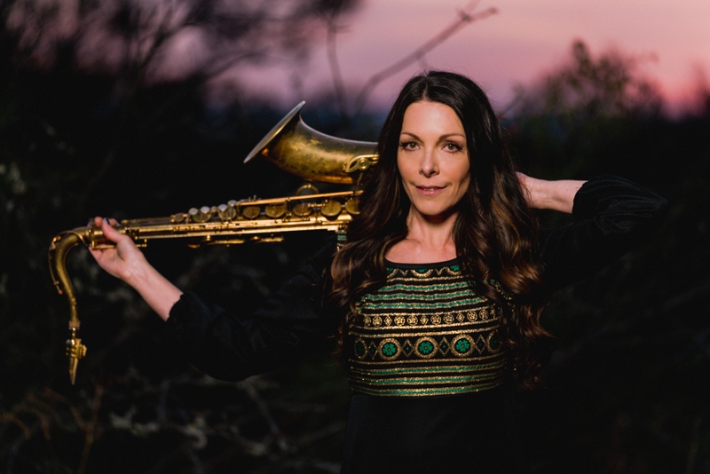 Colour photo of Nichola holding her saxophone - taken by Murray Clarke